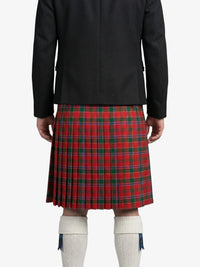 Person wearing a black jacket and red plaid kilt on a white background