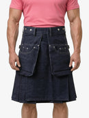Person wearing a pink shirt and denim kilt on a white background