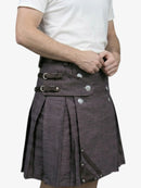 Person wearing a gray kilt with visible buttons on a white background