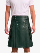 A dark green faux-leather kilt with silver-tone metal snap buttons and side flap pockets, worn by a model in a white t-shirt against a light gray background.