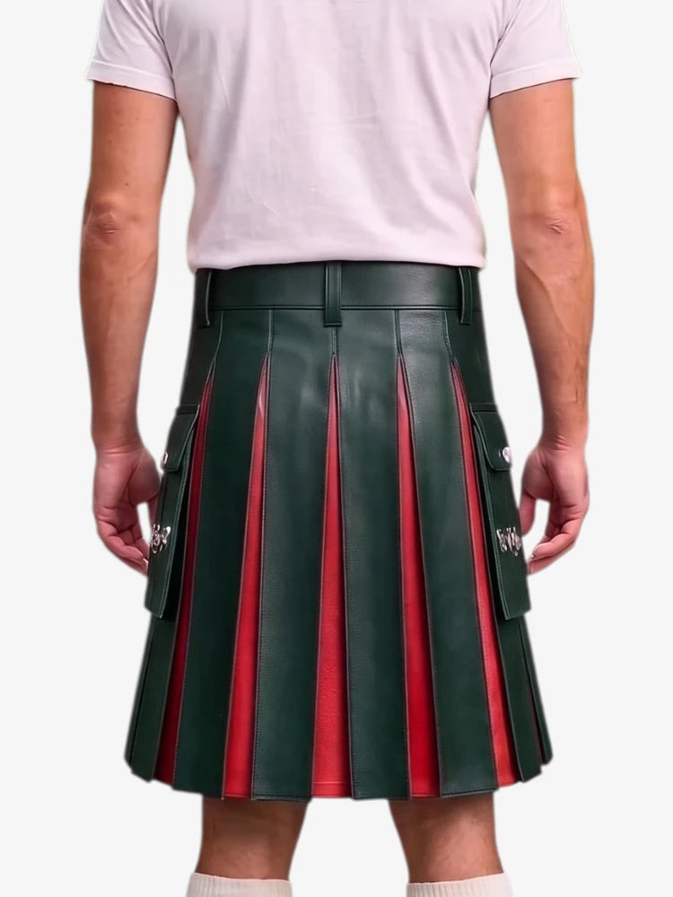 A person shown from the back wearing a dark green pleated leather kilt with red vertical stripe accents and silver hardware, paired with a light pink t-shirt and white socks, against a plain light gray background.
