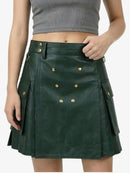 Green leather skirt with gold buttons worn by a person on a white background