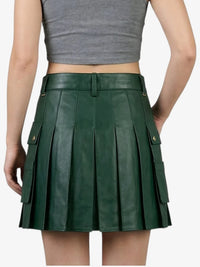 Green pleated skirt worn by a person on a white background