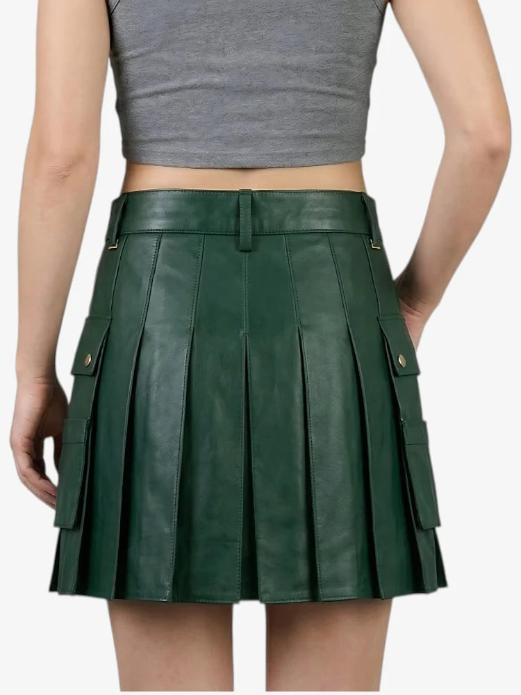 Green pleated skirt worn by a person on a white background