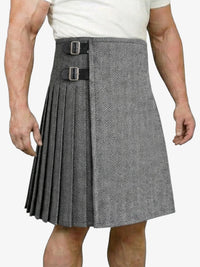 Gray pleated kilt worn by a person on a white background