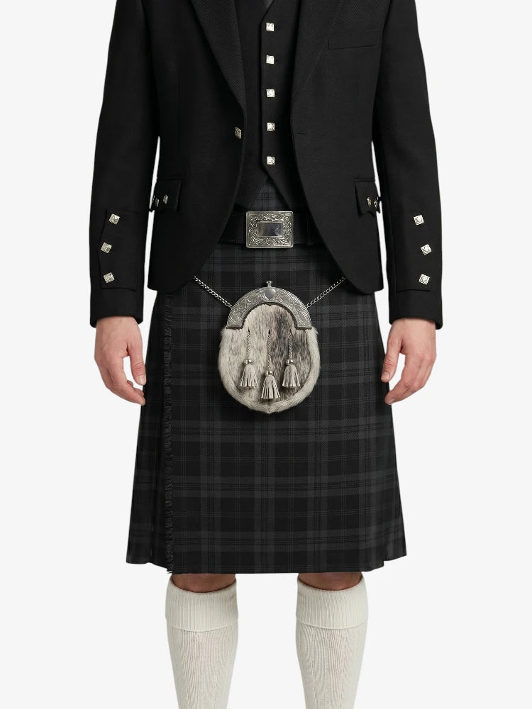 Person wearing a black kilt with a silver sporran on a white background