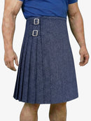 Person wearing a blue herringbone pattern kilt on a white background