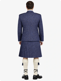 Person wearing a blue suit with a pleated kilt on a white background