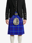 Person wearing a blue plaid kilt with a black jacket on a white background