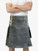 Person wearing a gray denim kilt with a white background