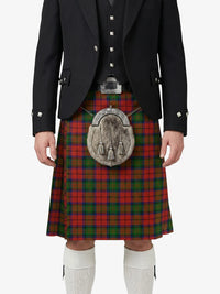 Person wearing a traditional Scottish kilt with a tartan pattern on a white background