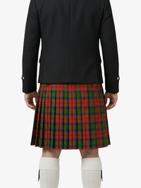 Person wearing a black jacket and red plaid kilt on a white background