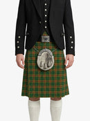 Person wearing a traditional Scottish kilt with a jacket on a white background
