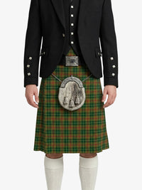 Person wearing a traditional Scottish kilt with a jacket on a white background