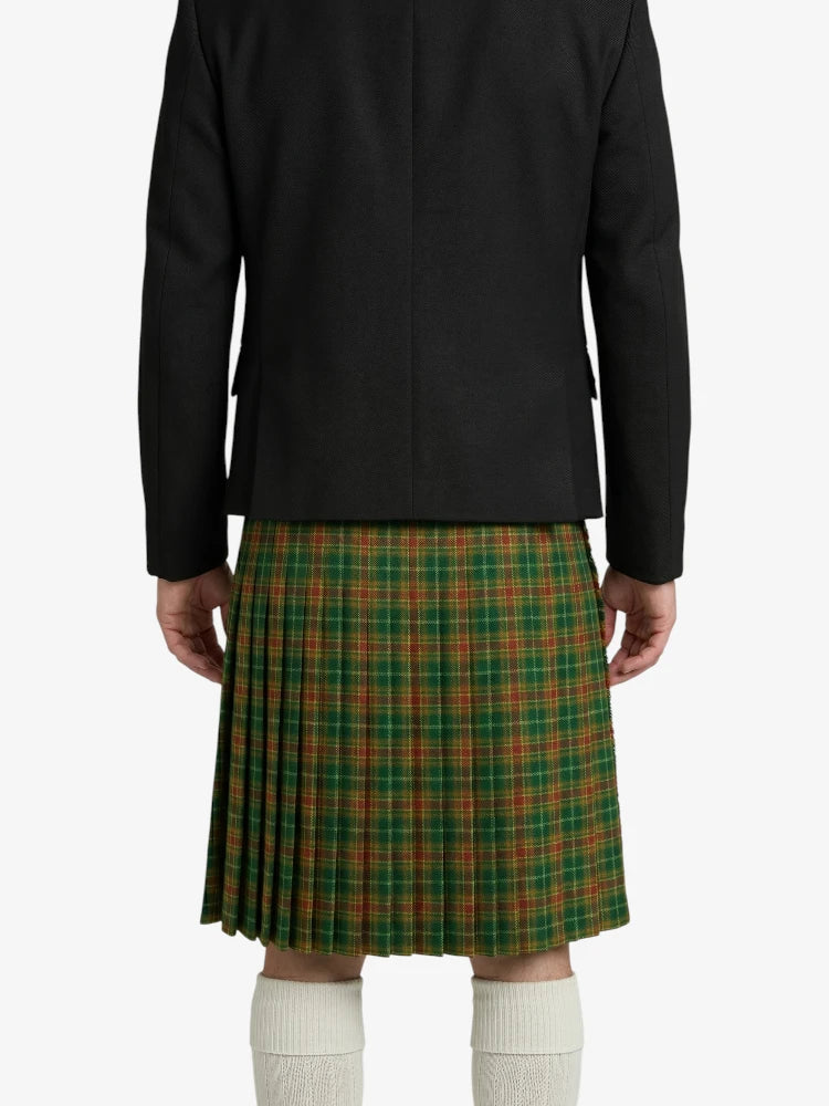 Person wearing a black jacket and green plaid kilt on a white background