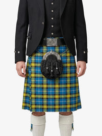 Person wearing a blue and yellow plaid kilt with a black jacket on a white background