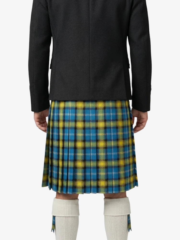 Person wearing a black coat over a blue and yellow plaid skirt on a white background