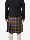 Person wearing a black jacket and plaid skirt on a white background