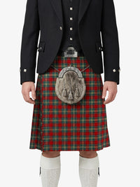 Person wearing a traditional Scottish kilt with a tartan pattern on a white background