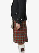 Person wearing a black jacket and red plaid kilt on a white background
