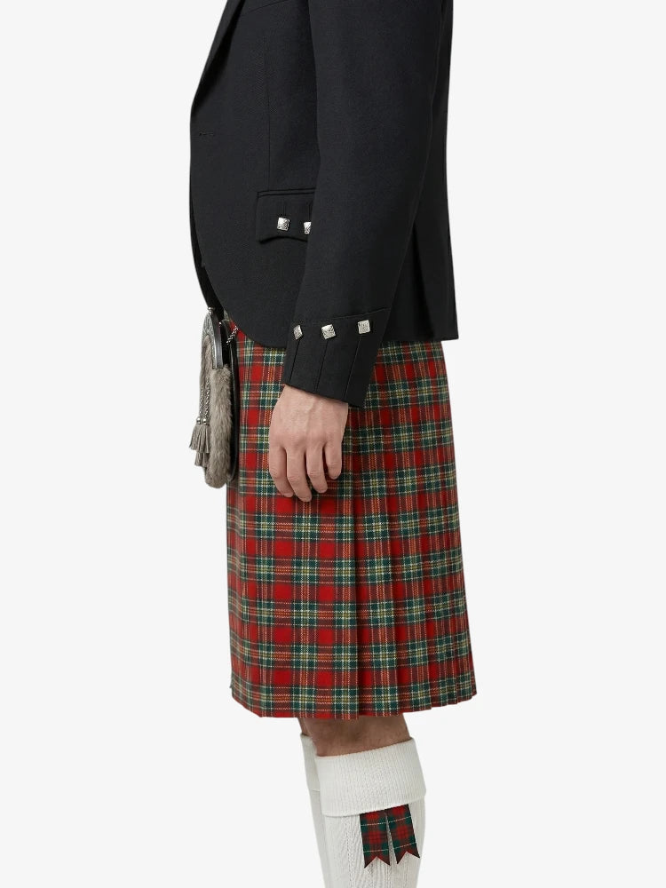 Person wearing a black jacket and red plaid kilt on a white background