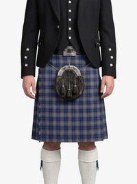 Person wearing a traditional Scottish kilt with a sporran on a white background