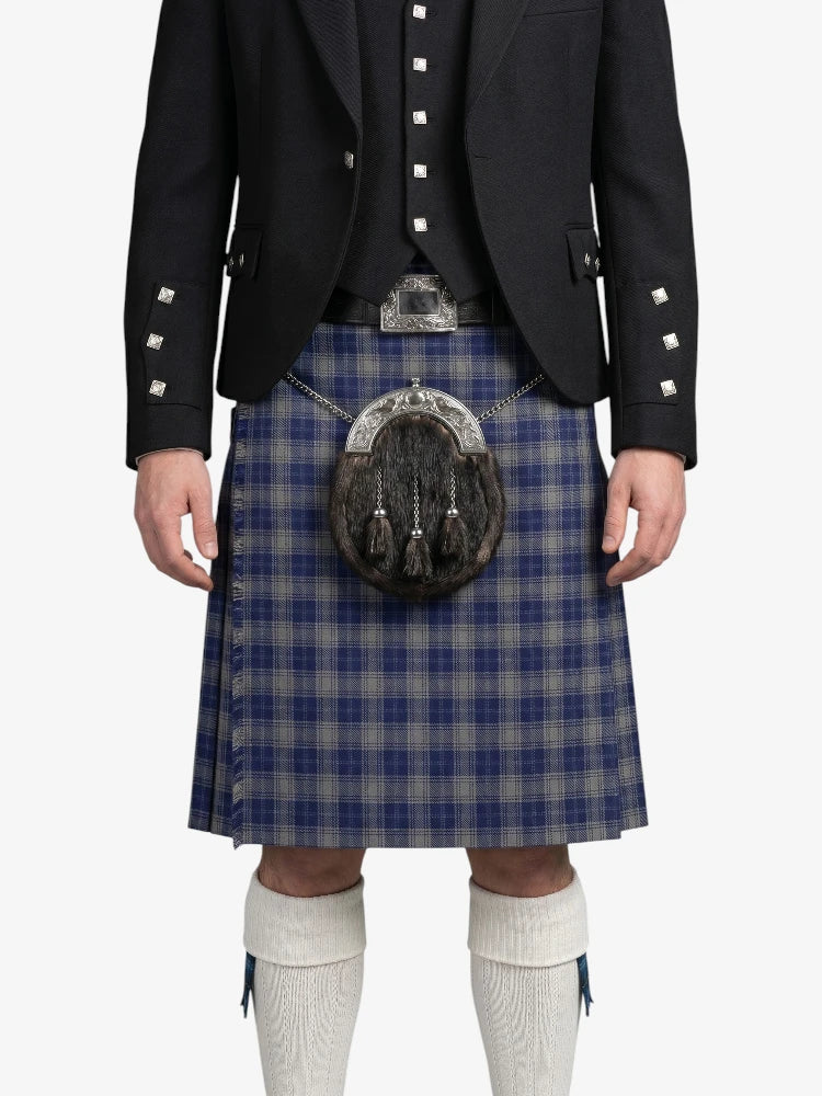 Person wearing a traditional Scottish kilt with a sporran on a white background