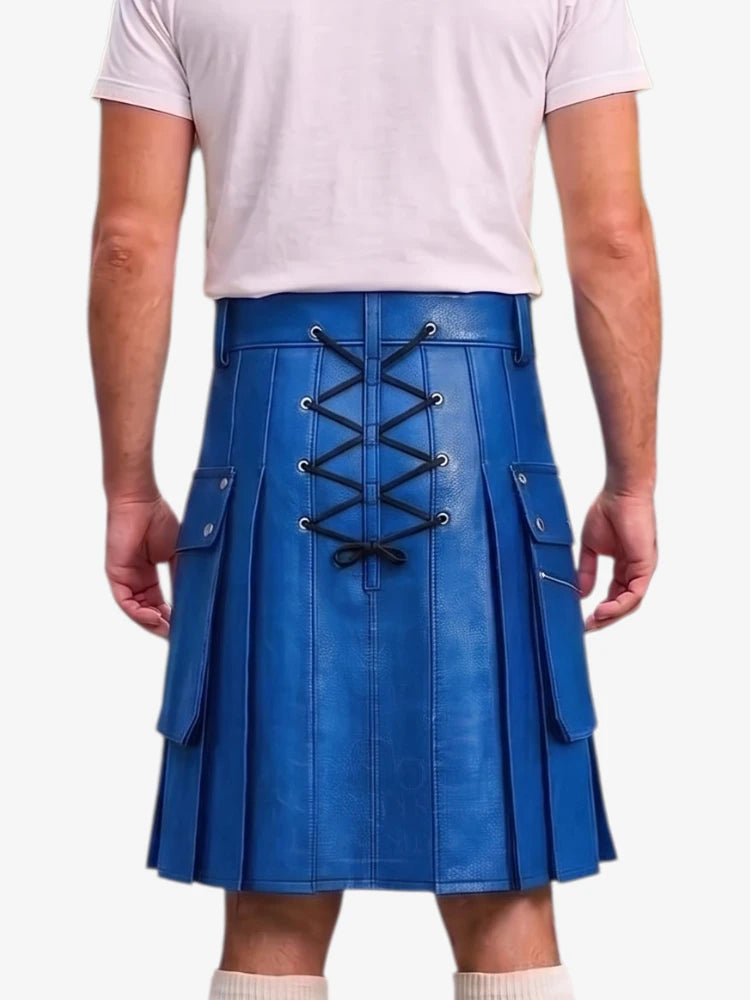 A person shown from the back wearing a bright blue pleated kilt with black lace-up detailing down the center, paired with a light pink t-shirt and cream socks, against a plain white background.