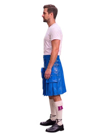 A man shown in profile wearing a bright blue leather kilt, a white t-shirt, white socks, and black shoes, standing against a plain white background.