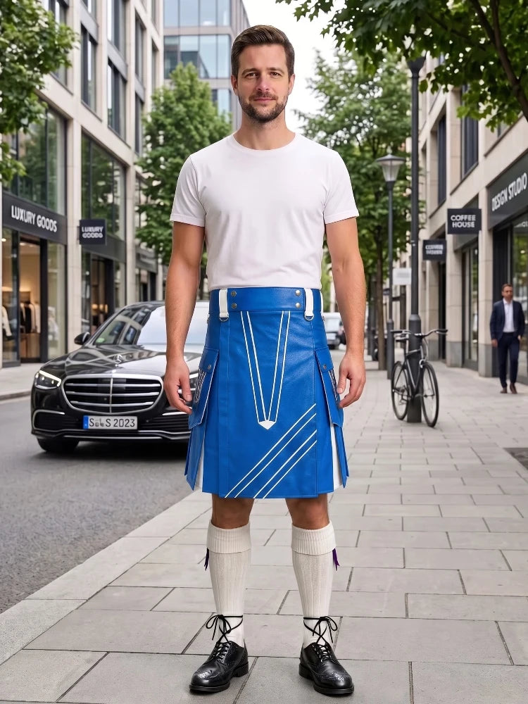 A man stands on a city sidewalk wearing a bright blue kilt with white geometric stripe details, a white t-shirt, white knee-high socks, and black leather shoes. Buildings, trees, a parked black car, and a bicycle are visible in the background.