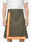 Green skirt with orange and white trim worn by a person on a white background