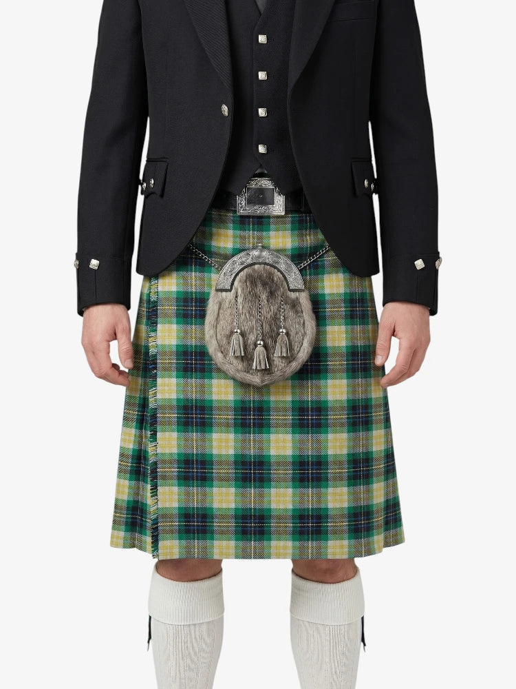Person wearing a traditional Scottish kilt with a tartan pattern on a white background