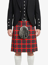 Person wearing a red tartan kilt with a black jacket on a white background