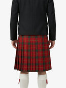 Person wearing a black jacket and red plaid kilt on a white background