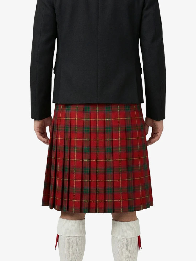 Person wearing a black jacket and red plaid kilt on a white background