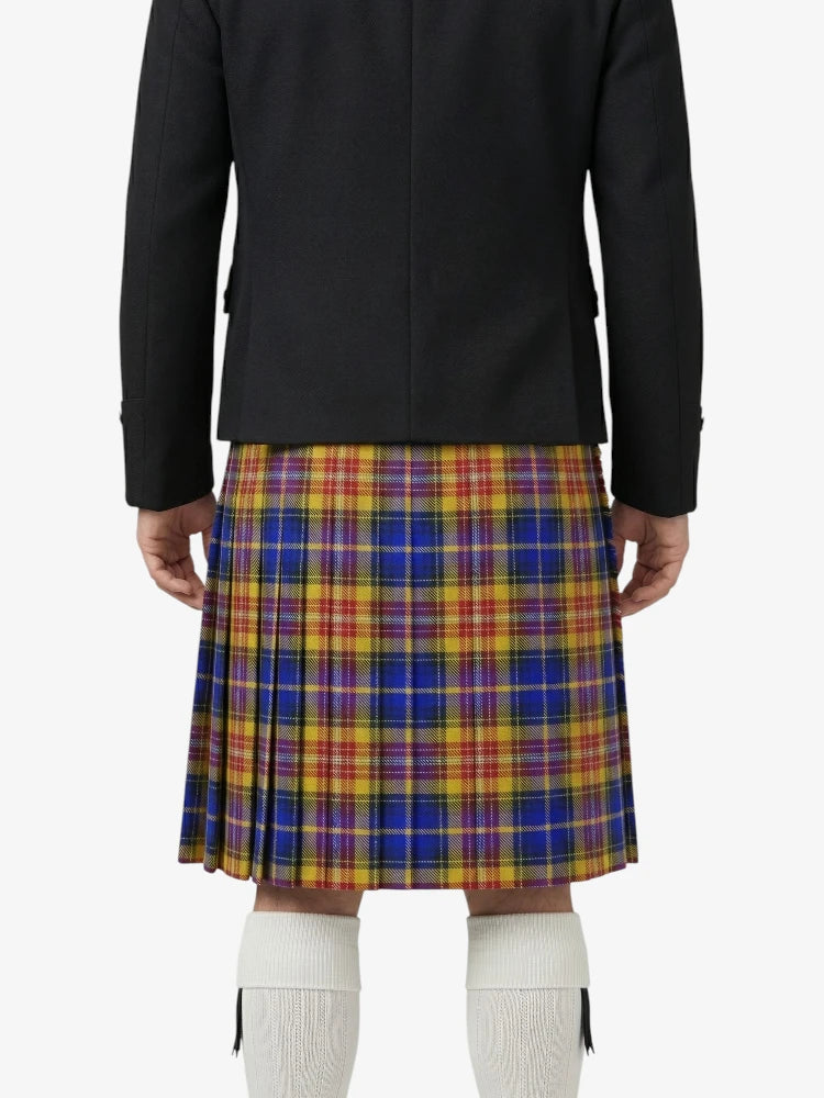 Person wearing a black jacket and colorful plaid kilt on a white background