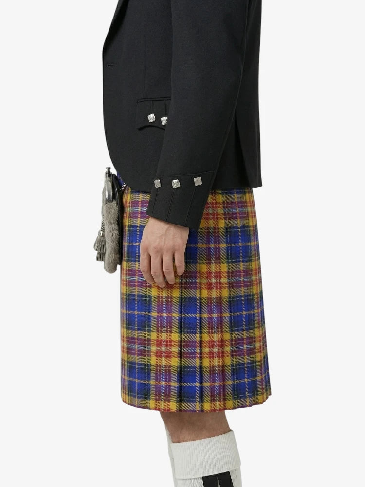 Person wearing a black jacket and colorful plaid kilt on a white background