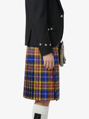 Person wearing a black jacket and a plaid kilt on a white background