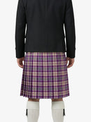 Person wearing a black jacket and purple plaid kilt on a white background