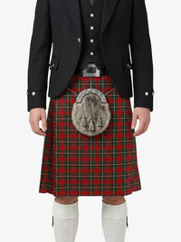 Person wearing a traditional Scottish kilt with a tartan pattern on a white background