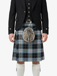 Person wearing a traditional Scottish kilt with a jacket on a white background