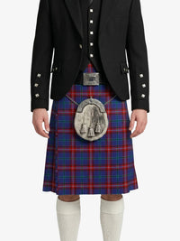 Person wearing a traditional Scottish kilt with a tartan pattern on a white background