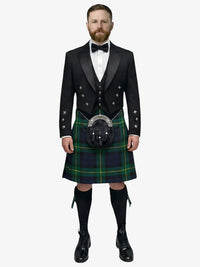 Man wearing a traditional Scottish gordon tartan kilt with a white shirt, black prince charlie jacket, and bow tie on a white background.