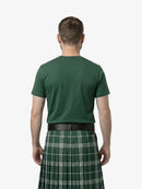 Man wearing a green t-shirt and green plaid kilt on a white background