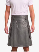 A gray faux-leather kilt with silver-tone metal buttons and side pockets, worn by a model in a white t-shirt against a light gray background.