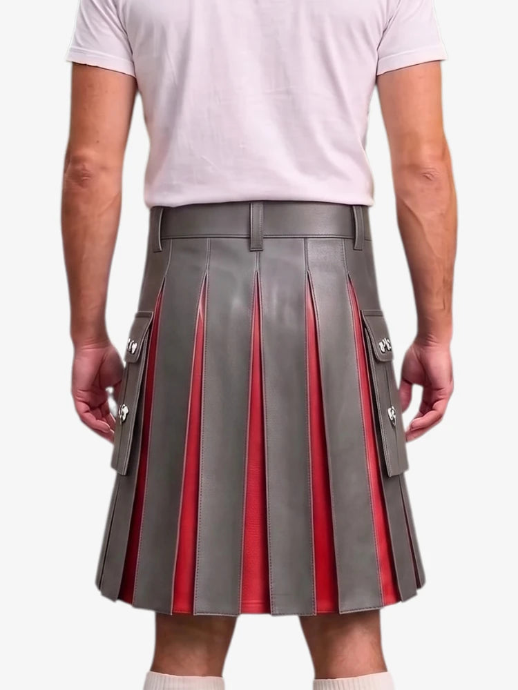 A gray pleated leather kilt with red inner panels and silver-tone decorative buttons, shown on a model from the back wearing a white t-shirt.
