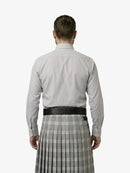 Man wearing a light gray shirt and plaid kilt on a white background