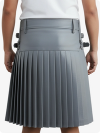 Gray pleated skirt worn by a person on a white background