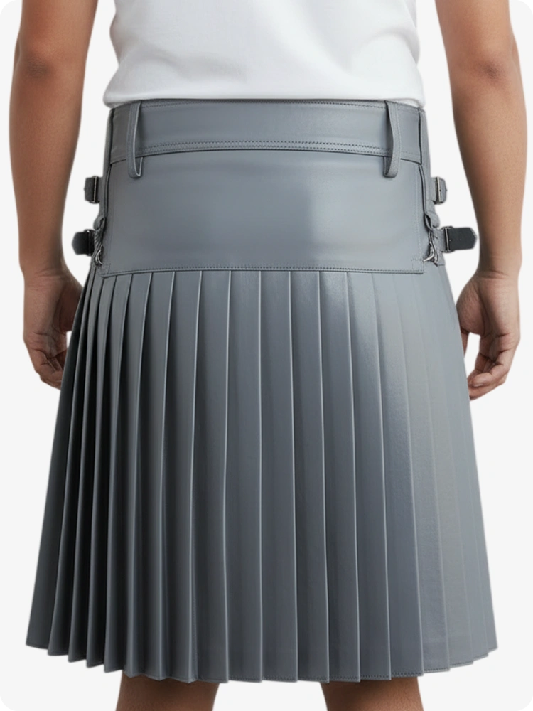 Gray pleated skirt worn by a person on a white background