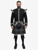Man wearing a black doublet Highland dress with white trim on a white background